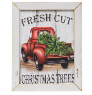 White framed “Fresh Cut Christmas Trees” print showing a red vintage pickup truck loaded with evergreen trees.